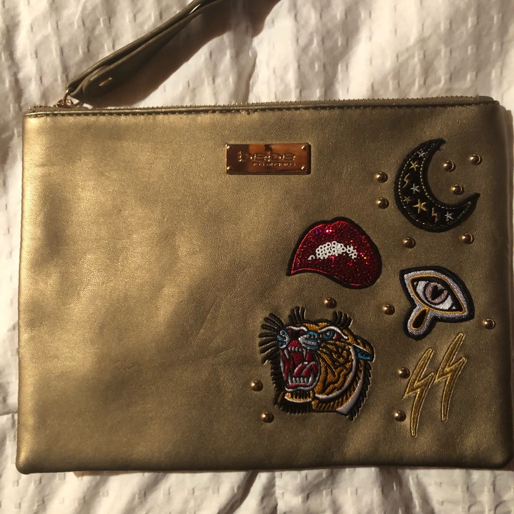 Bebe metallic gold wristlet